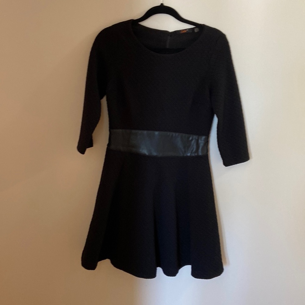 Black dress. Great swing on the bottom. Leather waistband